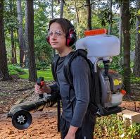George Watrous with a backpack Mosquito Mister